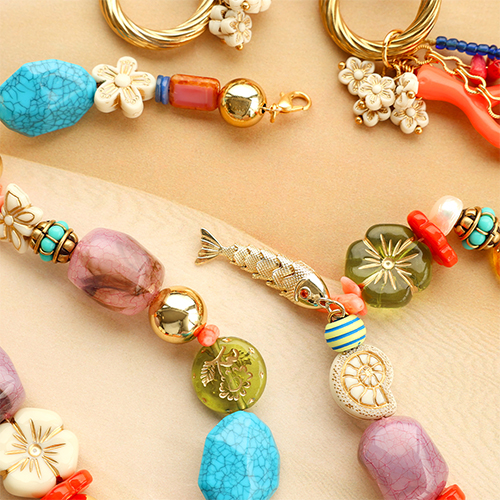 Acryl kralen met goudkleurige details