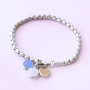 Oorbellen en armbandjes met hangers van crystal glas
