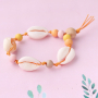 Sieraden met een strandthema van houten kralen, DQ metaal en schelpen